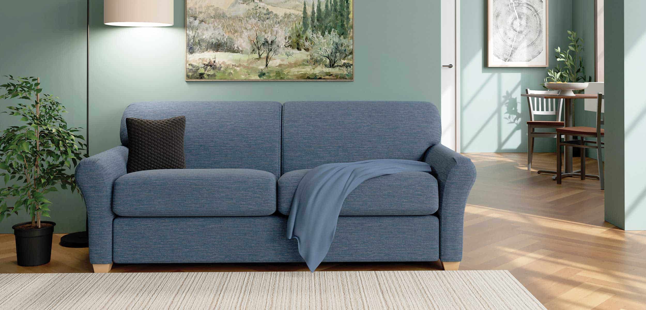 Blue Sofa in Group Home Living Room with small Dining Table and Chairs